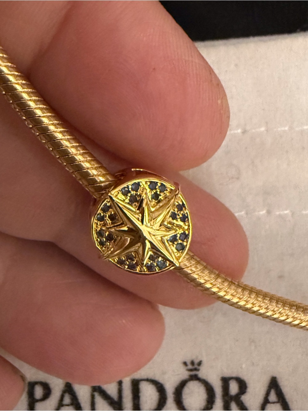 Michael Kors Gold Starburst Charm Bracelet with Blue Accents